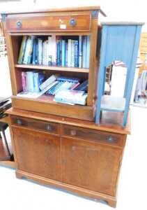 A yew wood finish open bookcase, with single drawer above open shelves, with a quantity of books,...