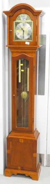 A Tempus Fugit yew wood finish Grandmother clock, with arched dial, raised spandrels, with...