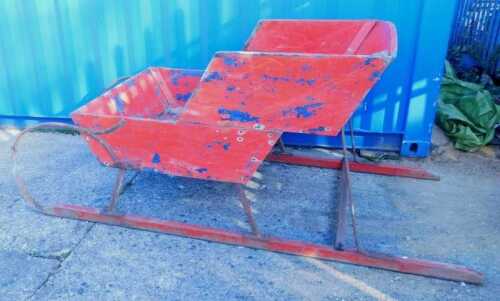 An unusual early 20thC scratch built wooden sleigh, with shaped stepped centre section, with...