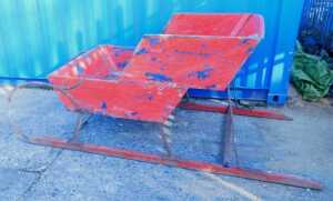An unusual early 20thC scratch built wooden sleigh, with shaped stepped centre section, with...