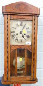 An oak cased wall clock, with Roman numeric dial and eight day movement. (AF)