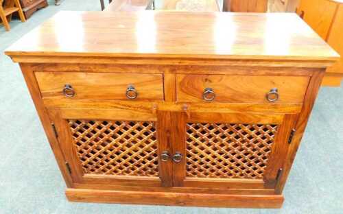 A Jig style side cabinet, with two frieze drawers above a pair of meshwork fronted cupboards.