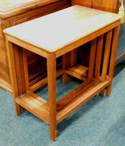A nest of four 20thC hardwood tables, probably Japanese, each of oblong form, on chamfered stiles.
