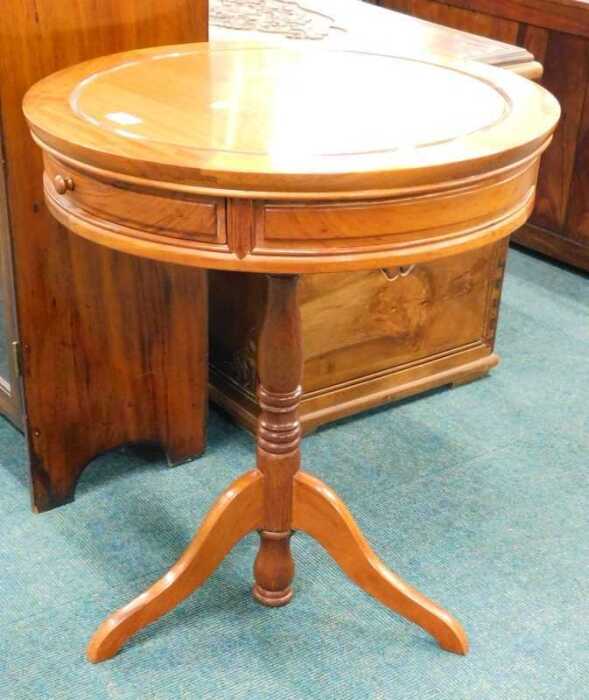 A late 20thC hardwood drum table, of circular form with two frieze drawers, on turned stem...