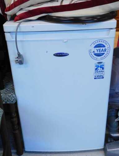 A Zanussi Essential 1200 6kg washing machine and an Ice King under counter fridge.