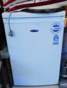 A Zanussi Essential 1200 6kg washing machine and an Ice King under counter fridge.