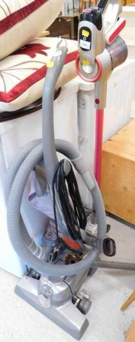An upright Wand Powersonic lithium power 26.16 volt vacuum cleaner, in pink and silver trim, and...