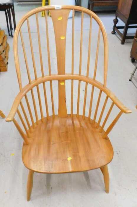 An Ercol light wood Windsor style chair.