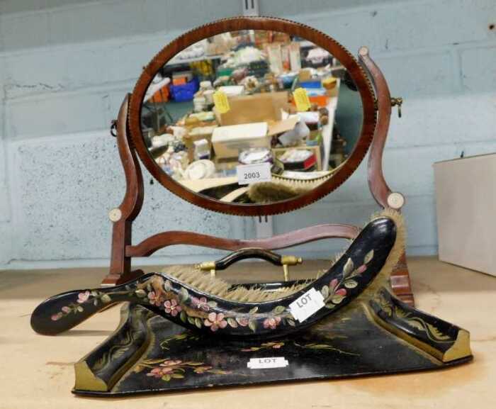 A late 19thC mahogany swing mirror of small proportion, with oval glass and shaped stiles, and a...