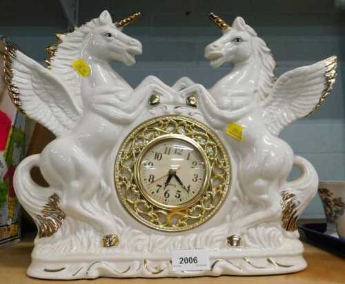 An elaborate 20thC quartz mantel clock, with pottery unicorn surround.