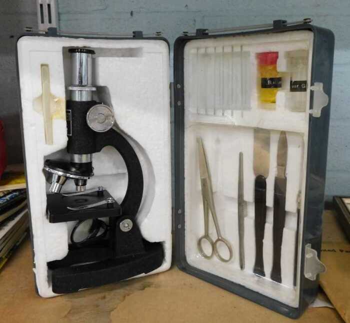 A cased student's microscope.