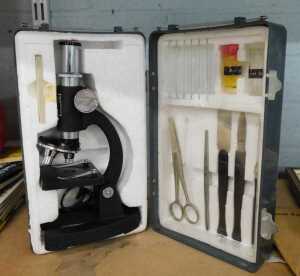 A cased student's microscope.