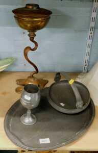 An elaborate copper Dali style table lamp, various pewter, basket, tray, and a plated Ruston Gas...