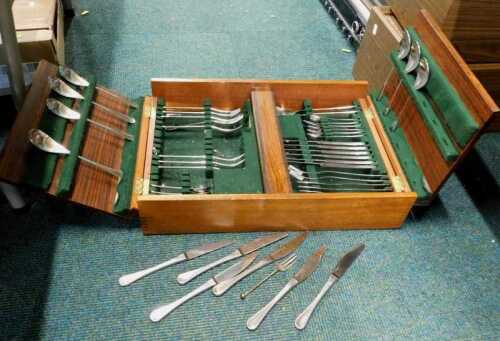 An Old Hall stainless steel part canteen, in Bombay rosewood effect case.