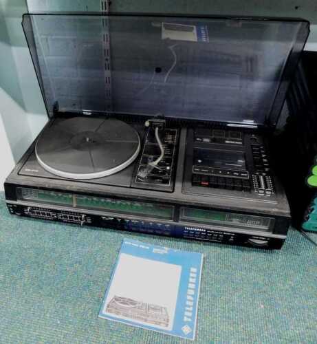 A Telefunken Studio Centre 5030 hi-fi music system, with Dolby system turntable and Perspex cover.