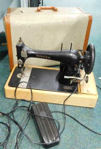 A cased electric sewing machine.