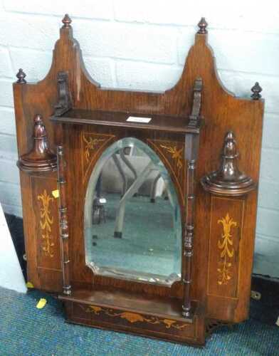 A rosewood overmantel mirror of small proportion.
