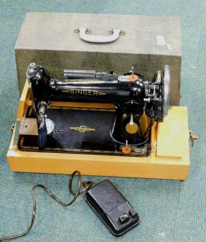 A cased electric sewing machine, model 201K. Reputed by the vendor that it has been serviced...