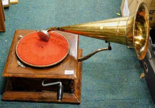 A 20thC HMV stamped gramophone, with brass horn, of small proportion.