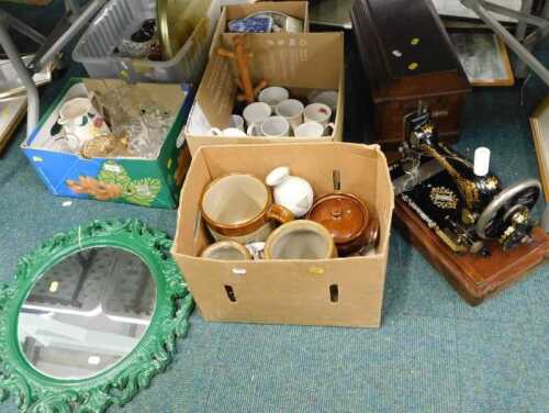 A walnut cased sewing machine, various glassware, stoneware jars, hanging mirror, cups, etc....