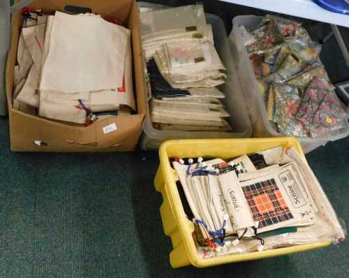 Four boxes of various linen, some in original packaging.