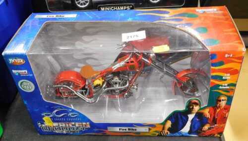 A Discovery Channel diecast boxed fire bike.