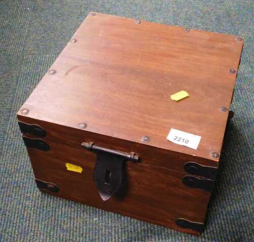 A hardwood box, with metal side carrying handles.