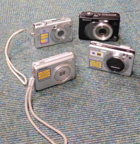 A Sony Cybershot digital camera, with Carl Zeiss built in lens, and two other similar digital...