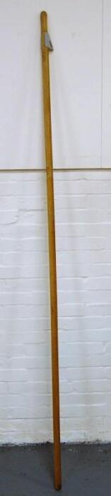 *A large wooden dip rod by Bentley & Taylor