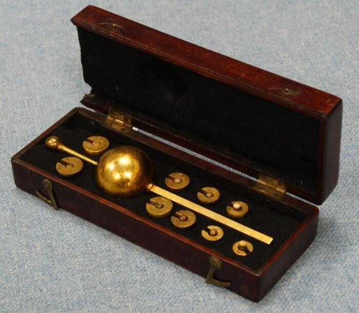 *A cased HM Customs & Excise hydrometer with weights
