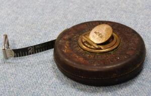 *A Chesterman leather cased tape measure for Customs & Excise.