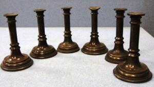 *A set of six late 19thC turned metal candlesticks