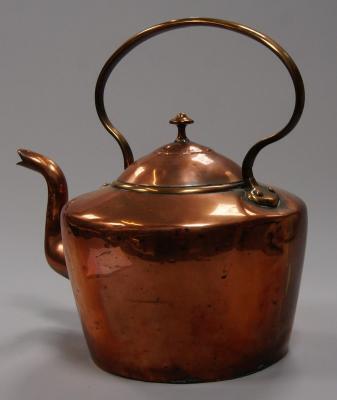 A large Victorian copper kettle.