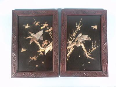 A pair of 19thC Japanese lacquer panels of eagles on a branch set within carved frames