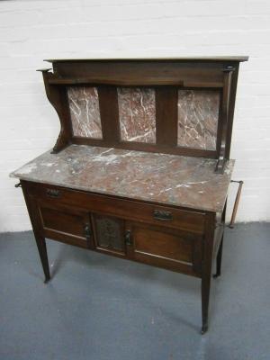 A late Victorian walnut washstand
