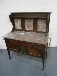 A late Victorian walnut washstand