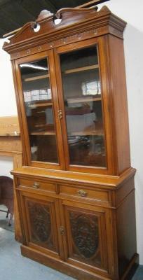 A late Victorian walnut cabinet bookcase