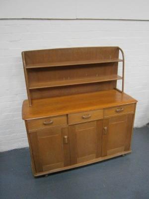 An Ercol sideboard with plate rack