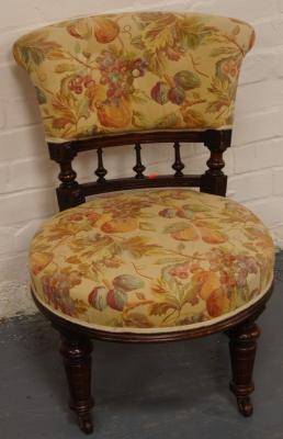 A Victorian walnut nursing chair