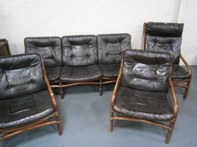A vintage brown leather and bamboo framed four piece suite.