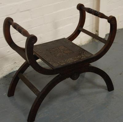 A late Victorian stained and carved beech window seat.