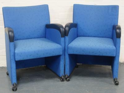 *A pair of blue office chairs