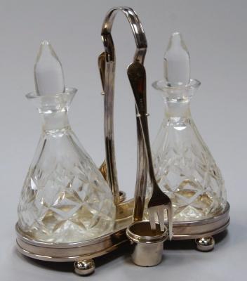 An EPNS oil and vinegar cruet.