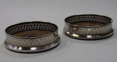 A pair of Elizabeth II silver wine coasters