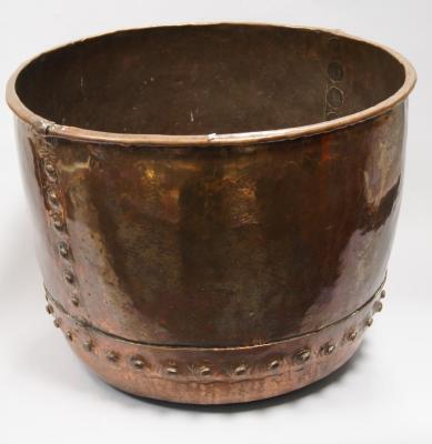 A copper log bin