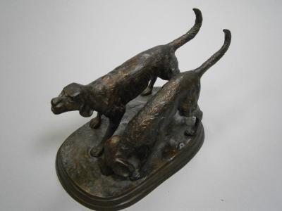 A bronze patinated figure group of two dogs