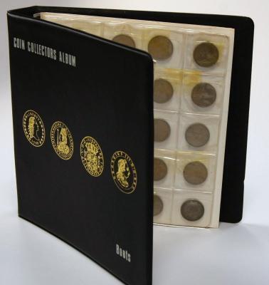 A coin collectors album containing forty new five pence