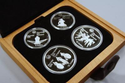 Seven Montreal Hall Olympic coin proof coin sets