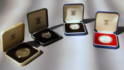 Four Royal Mint commemorative coins