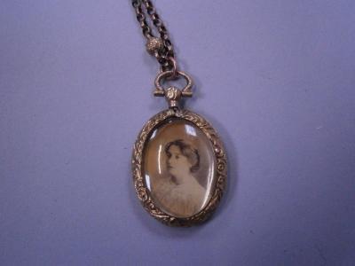 A necklace with portrait pendant